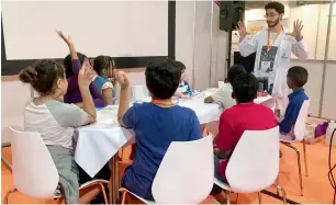  ??  ?? At the workshop, children were taught about the mysteries of deep space and wonders of the cosmos. It also gave science lessons to the children through fun programmes.