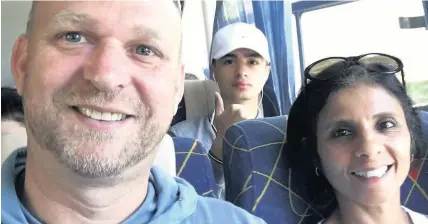  ??  ?? &gt; Jason Williams on the flight to Cuba with his wife Kamala and 15-year-old son Matthew