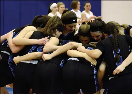  ?? MEDIANEWS GROUP FILE PHOTO ?? The 2019-20 Walled Lake Western girls basketball team huddles up prior to their Division 1 regional semifinal game against Clarkston. This would be the last game the Warriors played as the postseason was cancelled soon after due to COVID-19. The 2020-21 season is delayed as well, with no timetable for a return in sight.