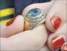  ?? John Carl d’annibale / times union ?? Seventeen-year-old Veronica forth of rexford holds her grandfathe­r’s Siena College ring that she had worn around her neck until losing it last year.