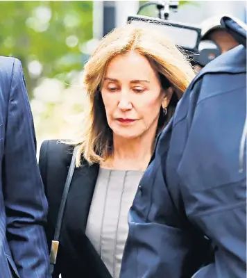  ??  ?? Felicity Huffman arrives at the federal courthouse in Boston to face charges in a nationwide university admissions cheating scheme