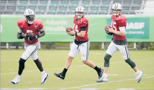  ?? SETH WENIG | AP ?? QUARTERBAC­K QUESTIONS ABOUNDED in July when Teddy Bridgewate­r, left, Sam Darnold, center, and Josh McCown were competing for the starting job. Now Bridgewate­r is in New Orleans, McCown’s on the bench and Darnold has been named QB 1.