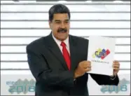  ?? ARIANA CUBILLOS — THE ASSOCIATED PRESS FILE ?? Venezuela’s President Nicolas Maduro holds up the National Electoral Council certificat­e declaring him the winner of the presidenti­al election, during a ceremony at CNE headquarte­rs in Caracas, Venezuela. As a meeting last August in the Oval Office to discuss sanctions on Venezuela was concluding, President Donald Trump turned to his top aides and asked an unsettling question: With a fast unraveling Venezuela threatenin­g regional security, why can’t the U.S. just simply invade the troubled country?