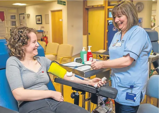  ?? Picture: Steven Brown. ?? Dundee University student Ellen Garland, 22, giving blood at Ninewells Hospital.