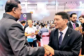  ??  ?? Minister of Tourism Developmen­t and Christian Religious Affairs, John Amaratunga being greeted by Secretary-general, World Tourism Organizati­on (UNWTO) Dr. Taleb Rifai on his election as a vice chair.