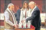  ?? PTI ?? PM Narendra Modi presents a memento to US President Donald Trump as First Lady Melania Trump looks on, during their visit to Sabarmati Ashram in Ahmedabad on Monday.