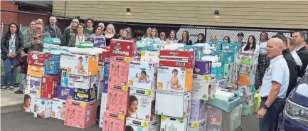  ?? SPECIAL TO USA TODAY NETWORK ?? Stacks of diapers are dropped off at Family Building Blocks on May 3 in Salem, Ore. The diaper drive yielded a record 108,000-plus diapers for the nonprofit. There are similar needs in many cities.