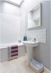  ??  ?? BATHROOM Pale greys create a calm ambience. walls painted in Ammonite estate emulsion, £ 43.50 per 2.5 litres, Farrow & ball. white metro wall tiles, £19.50sq m, topps tiles