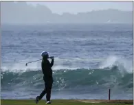  ?? ?? Former Chico High standout Kurt Kitayama follows his shot from the 18th fairway of the Pebble Beach Golf Links during the fourth round of the AT&T Pebble Beach Pro-Am in Pebble Beach on Monday. Kitayama shot a 76 in the final round.