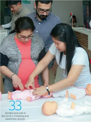  ?? Supplied photos ?? Parents received training during a baby safety session organised by Aster. —