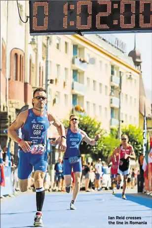  ??  ?? Ian Reid crosses the line in Romania