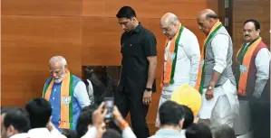  ?? — AFP ?? India’s Prime Minister Narendra Modi (left), Home Minister Amit Shah (third from right)), Defence Minister Rajnath Singh (second right) and BJP’S president J.P. Nadda (right) leave after releasing the party manifesto.