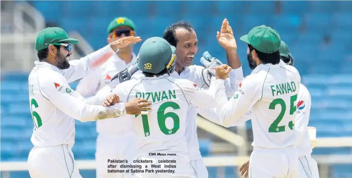  ?? CWI MEDIA PHOTO ?? Pakistan’s cricketers celebrate after dismissing a West Indies batsman at Sabina Park yesterday.