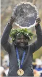  ?? Sarah Stier / Getty Images ?? Joyciline Jepkosgei of Kenya won in her first attempt at a marathon.