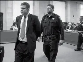  ?? ANTONIO PEREZ/CHICAGO TRIBUNE VIA AP, POOL ?? CHICAGO POLICE OFFICER JASON VAN DYKE (LEFT) is taken into custody after jurors on Friday found him guilty of second-degree murder and aggravated battery in the 2014 shooting of black teenager Laquan McDonald at the Leighton Criminal Court Building in Chicago.PRISON CONDITIONS