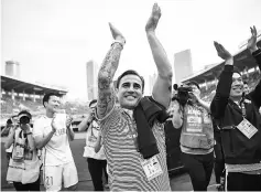  ?? - AFP photo ?? (FILES) This file picture taken on November 4, 2017 shows Tianjin Quanjian head coach Fabio Cannavaro (C) applauding their victory against Guangzhou Evergrande during the Chinese Super League (CSL) football league in Guangzhou, in China’s southern...