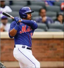  ?? FRANK FRANKLIN II — THE ASSOCIATED PRESS ?? Mets’ Eduardo Escobar hits an RBI single against the Atlanta Braves.