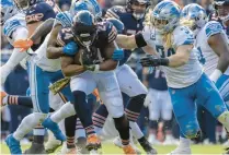  ?? ERIN HOOLEY / CHICAGO TRIBUNE ?? Chicago Bears running back Khalil Herbert (24) gets taken down during the second quarter against the Detroit Lions.