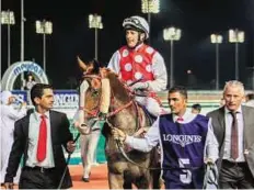  ?? Rex Features ?? Impressive run Trainer Eric Lemartinel celebrates RB Torch’s victory in Dubai earlier this month. The Al Asayl-based trainer added three more victories in the second meeting in Al Ain on Saturday.