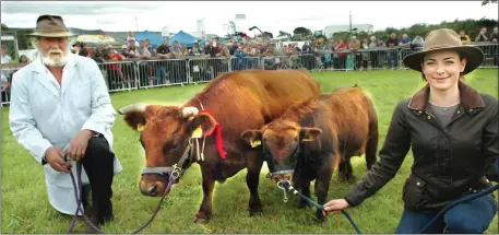  ??  ?? One of our nation’s smallest cattle breeds, Dromore West’s Henry and Aisling Judge proudly kneel alongside their Champion Dexter at Bonniconlo­n Show. Picture Henry Wills.