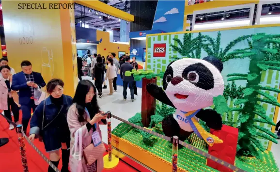  ??  ?? The CIIE mascot “Jinbao” made of Lego blocks takes the center stage of the space for high-quality life.