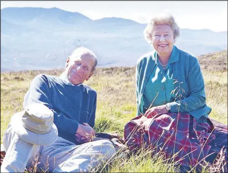  ?? REUTERS ?? Handout image released by Buckingham Palace and taken by the Countess of Wessex shows Britain’s Queen Elizabeth II and Prince Philip, the Duke of Edinburgh, at the top of the Coyles of Muick in 2003.