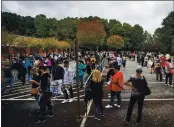  ?? RON HARRIS — THE ASSOCIATED PRESS ?? On Monday hundreds of people wait in line for early voting in Marietta, Ga.