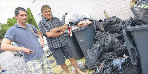  ?? Picture: Chris Davey FM4430487 ?? John Hake and Denis Hall with the rubbish dumped in and around their bins