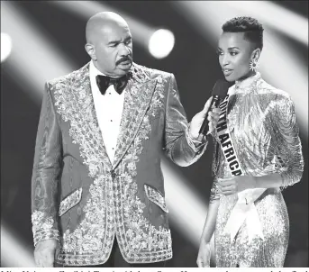  ?? (etonline.com photo) ?? Miss Universe Zozibini Tunzi with host Steve Harvey as she answered the final question.