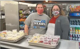  ?? Courtesy ?? At top right: Serving lunch to Broken Bow students each school day and providing a meal to the school board Monday evening are Kitchen Manager Angela Baltz, left, and Food Service Director Ryndi Keezer, both with Lunchtime Solutions.