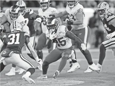  ?? JEFF HAYNES/AP IMAGES FOR PANINI ?? Rams running back Sony Michel carries against the Packers on Nov. 28. Michel rushed for 121 yards and a touchdown last week in the Rams’ 37-7 rout of Jacksonvil­le.