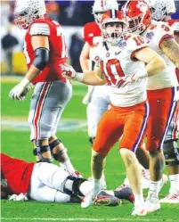  ?? AP FILE PHOTO/ RICK SCUTERI ?? Clemson linebacker Baylon Spector (10), a former Calhoun High School standout, returns to his home state this week as the top-ranked Tigers visit Georgia Tech on Saturday. Spector leads the team with 27 tackles this season through four games.
