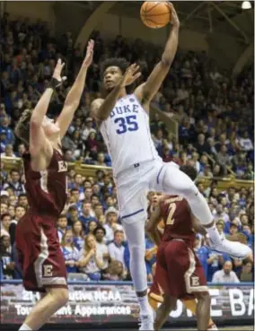  ?? BEN MCKEOWN — THE ASSOCIATED PRESS ?? Duke’s Marvin Bagley III (35) attempts a shot over Elon’s Tyler Seibring, left, during the second half in Durham, N.C., Friday. Duke defeated Elon, 97-68.