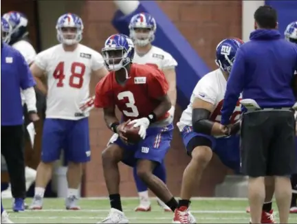  ?? PHOTOS BY JULIO CORTEZ — THE ASSOCIATED PRESS FILE ?? In this Thursday file photo, New York Giants’ Geno Smith (3) runs a drill during the team’s organized team activities at its NFL football training facility in East Rutherford, N.J. Smith didn’t catch a break in his final two seasons with the New York...