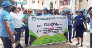  ?? ?? Officials of the Nigeria Social Insurance Trust Fund (NSITF) Mararaba Branch in Nasarawa State celebratin­g World Day for Safety and Health at Work 2022 with the theme, ‘Let’s Together To Build A Positive Safety and Health Culture’, recently