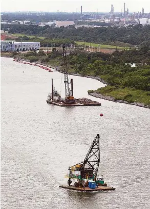  ?? James Nielsen / Houston Chronicle ?? Dredging work continues in June near the Bayport Container Terminal. Regular dredging is essential to maintainin­g the Ship Channel’s depth.