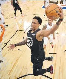  ?? BOB DONNAN, THE ASSOCIATED PRESS ?? Team Steph’s DeMar Derozan, of the Toronto Raptors, flies to the hoop during the all-star game in Los Angeles.