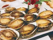  ??  ?? Shell game: The abalone on Jeju Island, harvested by women divers, is fresh, flavorful and delicious.