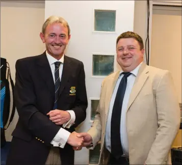  ??  ?? Ray McElhinney, winner of the President’s Prize competitio­n at Blainroe Golf Club, receives his prize from Club President Terence Ryan.