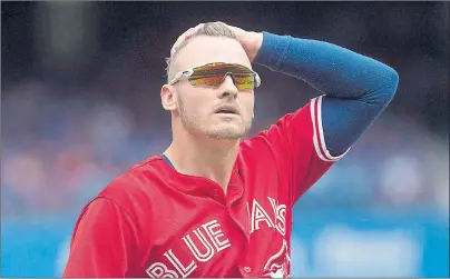  ?? CP PHOTO ?? Toronto Blue Jays third baseman Josh Donaldson makes his way back to the dugout at the end of first inning in American League MLB action against the Houston Astros in Toronto on Sunday.