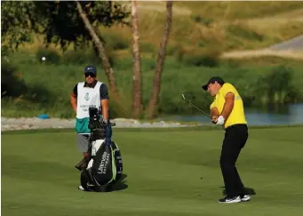  ?? GETTY IMAGES ?? NO SWEAT: Patrick Reed hits a shot on the 16th hole yesterday at Liberty National Golf Club.