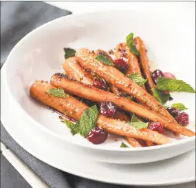  ?? Contribute­d photos ?? Roasted Carrots and Cranberrie­s, one of the recipes from “The Cranberry Cookbook.” The Cranberry Cookbook, by Sally Vargas, courtesy of Globe Pequot.