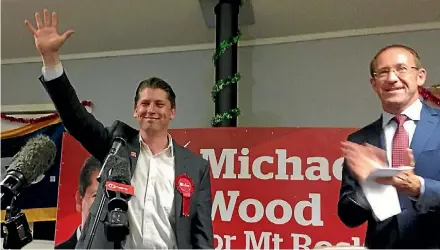  ?? CATRIN OWEN/FAIRFAX NZ ?? New Mt Roskill MP Michael Wood and Labour leader Andrew Little celebrate Wood’s victory.