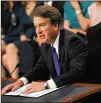  ?? MARK WILSON / GETTY IMAGES ?? Kavanaugh reads his opening statement Tuesday. “A judge must interpret the Constituti­on as written, informed by history and tradition and precedent,” he said.