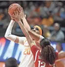  ?? ?? Tennessee’s Tamari Key (20) tries to get a shot off while Ohio State’s Celeste Taylor defends during Sunday’s game.