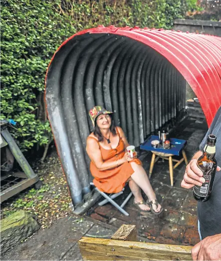  ?? Pictures: Mhairi Edwards. ?? Mary and Kevin Findlay relaxing in their Anderson shelter. Right: The view from inside.