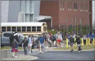  ?? (NWA Democrat-Gazette/Charlie Kaijo) ?? Students end the school day Aug. 24 at Bentonvill­e High School. The School District is allowing high school seniors to take fewer courses than usually required for graduation this year to help with social distancing in schools during the covid-19 pandemic, administra­tors say. Go to nwaonline.com/200921Dail­y/ for today’s photo gallery.