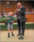  ?? SUBMITTED PHOTO ?? Jackson Bauer, 7, his citation for heroism, presented by Ridley Sixth Ward Commission­er Mike McCrea, for saving his baby sister from a fire.