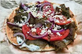  ?? / LIGAYA.FIGUERAS@AJC.COM LIGAYA FIGUERAS ?? Yiayia’s Gyro Bites are among the appetizers on the menu at Athens Pizza.