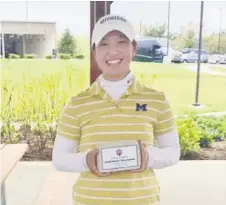  ??  ?? Ashley Lau finished as the first runner-up at the 28th Michigan PGA Women’s Open in June this year. In this photo, Ashley is seen with the trophy she won at Indiana Invitation­al in April a er carding a three-day total gross score of four-under 216.